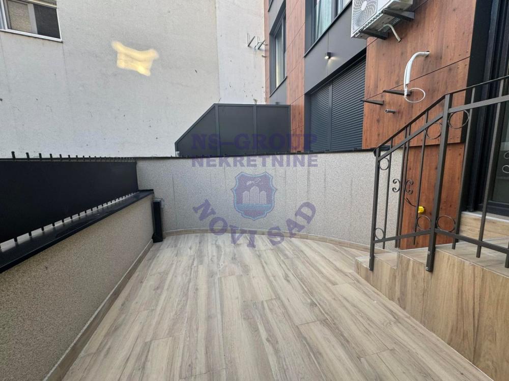 Slika 4 - 565856-Na prodaju je potpuno nova garsonjera od 27 m², smeštena na prizemlju moderne zgrade u samom centru Novog Sada.