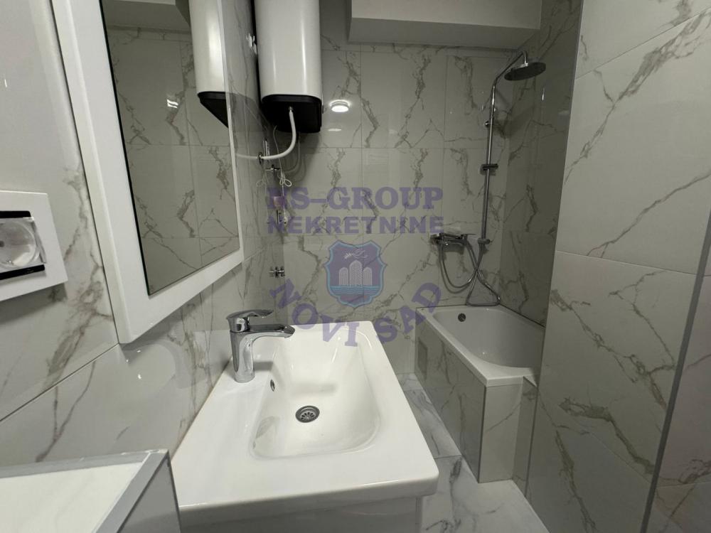 Slika 2 - 565856-Na prodaju je potpuno nova garsonjera od 27 m², smeštena na prizemlju moderne zgrade u samom centru Novog Sada.