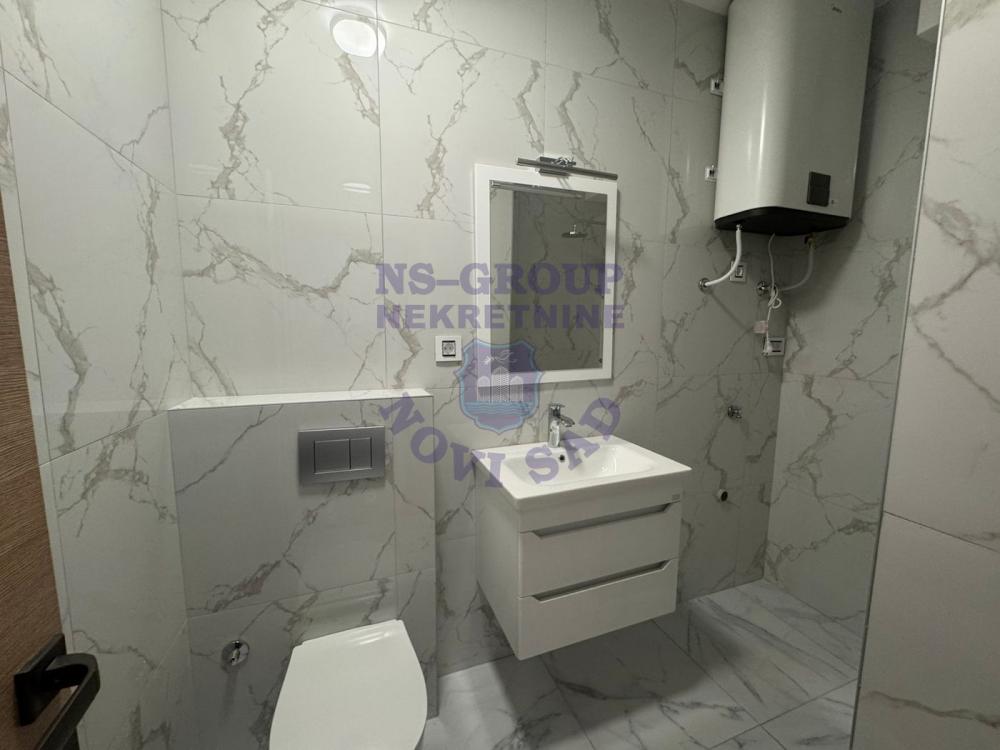 Slika 3 - 565856-Na prodaju je potpuno nova garsonjera od 27 m², smeštena na prizemlju moderne zgrade u samom centru Novog Sada.